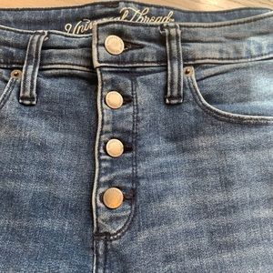 High rise skinny jeans with button fly